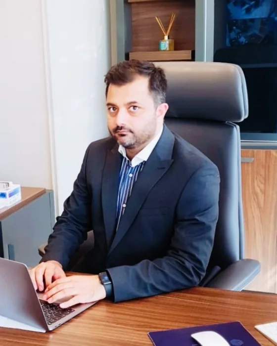 Dr. Ali Rana Sajad, President and CEO of Imperial Holdings, at his desk